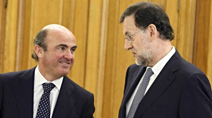 Luis de Guindos y Mariano Rajoy, en una imagen reciente.