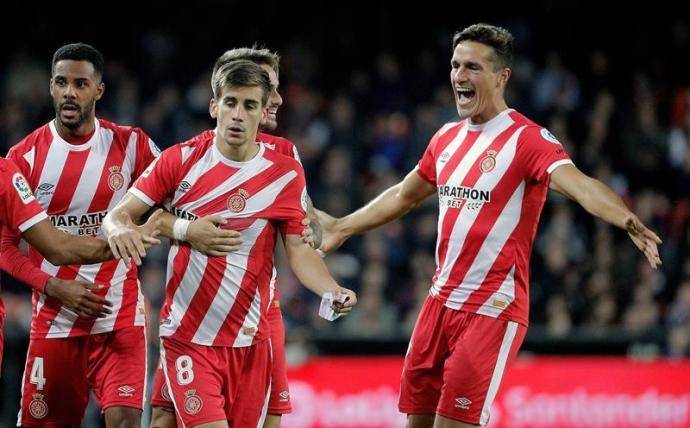 Los jugadores del Girona celebran el único tanto del partido