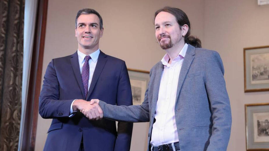 Sánchez e Iglesias tras rubricar su acuerdo de Gobierno